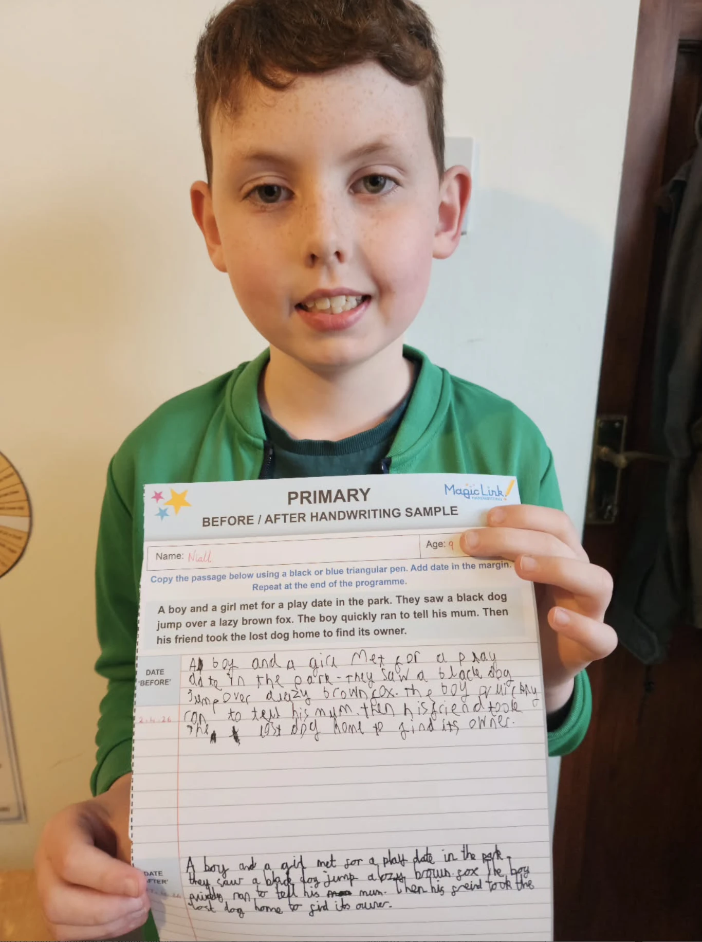 A pupil holding his completed Magic Link primary before and after handwriting sample